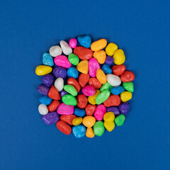 the shape of the circle formed with colored pebbles	