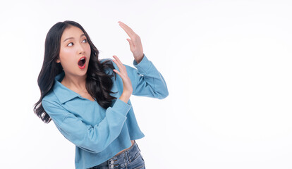 Excited asian woman casual holding hand shocked surprised sale product with copy space over white...