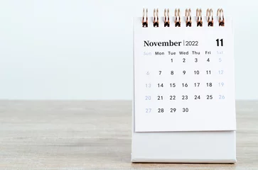 Deurstickers November 2022 desk calendar on wooden background. © gamjai