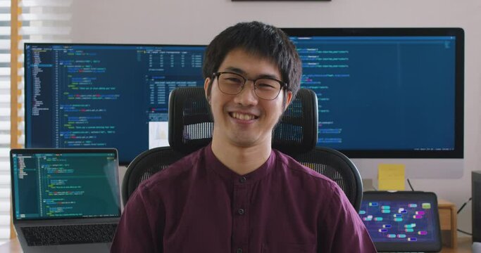 Digital transformation future workforce web DEV career. Asia people young talent man relax smile look at camera remote work at home office reskill upskill job on AI cloud computing cyber security.