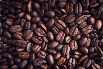 Roasted coffee beans background. Selective focus