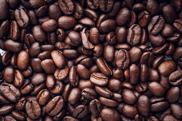 Roasted coffee beans background. Selective focus