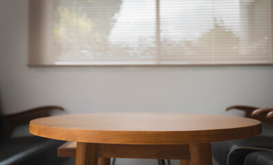 Wooden brown table in the room for meeting and drinking coffee.