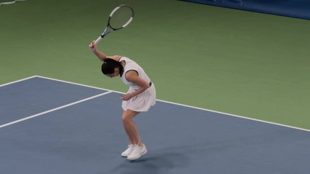 Tennis Championship Match: Female Player Strikes Ball with Racquet, Finishes Set. Professional Woman Athlete Walks after Perfect Shot. World Sports Tournament TV Channel Playback. Slow Motion 