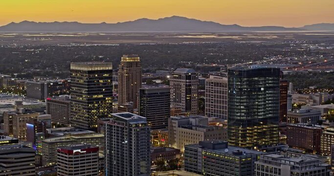 Salt Lake City Utah Aerial v36 drone fly around downtown capturing illuminated cityscape in the central city with west landscape view at sunset - Shot with Inspire 2, X7 camera - October 2021