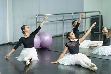 Fototapeta na wymiar Ballerina girl dance practice in the room, kid ballet dance concept.