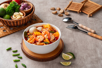Shrimp soup bowl, Tom yum or tom yam is a type of hot and sour Thai soup, usually cooked with...
