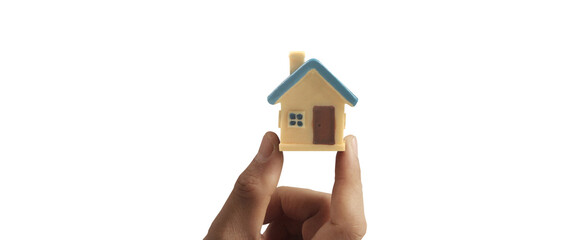 Fototapeta na wymiar Hand holding house model. property insurance and security Buy rent house concept