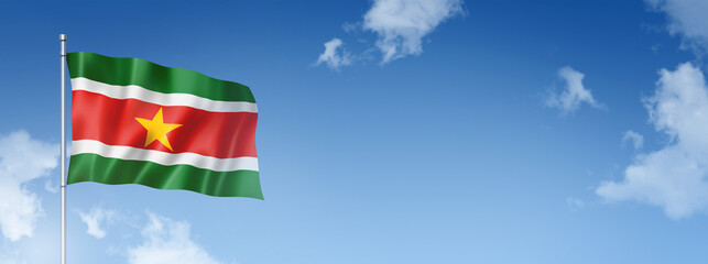 Suriname flag isolated on a blue sky. Horizontal banner