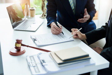 Law, Consultation, Agreement, Contract, Attorney or Lawyer holding a pen is consulting with a client to explain the pattern of answering questions before going to court to decide a lawsuit.