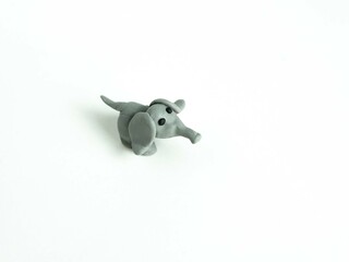 Plasticine craft gray elephant. Sculpting for children, development of motor skills. View from above