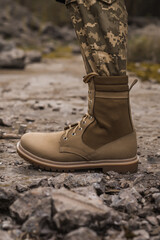 A soldier shod in special tactical khaki shoes