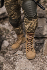 A soldier shod in special tactical khaki shoes