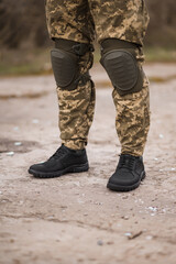 Military man in black tactical sneakers