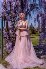 Beautiful woman in wisteria photoshoot