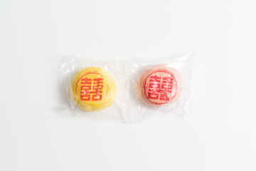 Wedding cookies for Chinese pre-wedding gift ceremony (Guo Da Li), Chinese betrothal ceremony isolated on white background. Chinese font translation “Double Happiness”