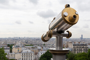 telescope on observation deck on Montmartre in Paris