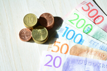 Closeup shot of swedish krona banknotes and coins - obrazy, fototapety, plakaty