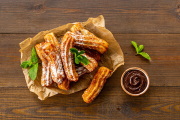 Spanish churros waffles on baking paper, top view