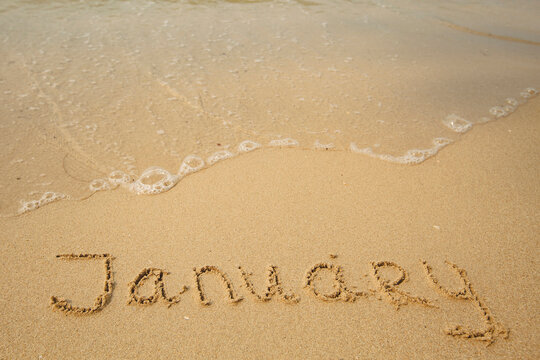 January - drawing on the soft beach sand with a soft lapping wave.