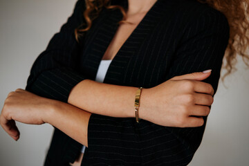 women's gold bracelet on girl's hand, women's accessories, jewelry, gold bracelet with stones,...