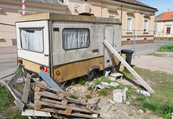 Old ruined caravan at the construction site