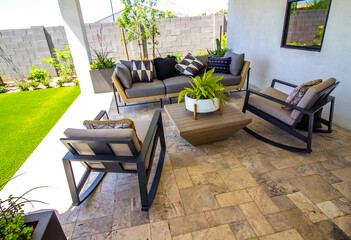 Rear Patio With Couch And Two Rocking Chairs
