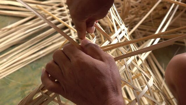 Close up hand weaving basket from bamboo