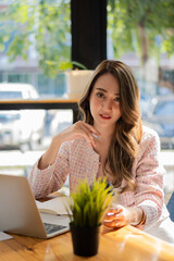 businesswoman or accountant Asian girl working on laptop Financial investment trading concept with a calculator. Calculate. Analyze business and market growth on an accounting data graph. Economy