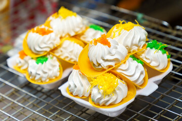 Thai crispy pancakes placed on foam cups. Khanom buang