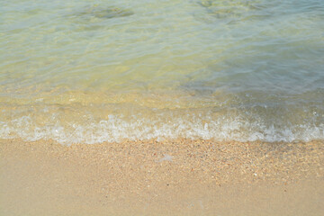 Fototapeta na wymiar Beach sand and wave sea background.