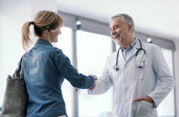 Doctor greeting a patient in his office