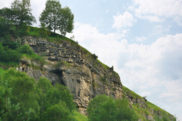 Naklejka premium Amazing view of rocks with trees in foothills of North Caucasus.
