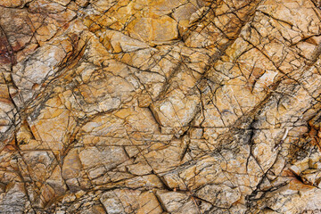 textures and patterns of natural broken rocks and erosion of sea water over time