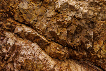 textures and patterns of natural broken rocks and erosion of sea water over time, for background