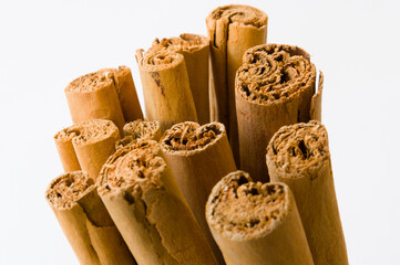 Rolled dry cinnamon isolated on a white background