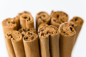 Rolled dry cinnamon isolated on a white background