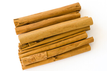 Rolled dry cinnamon isolated on a white background