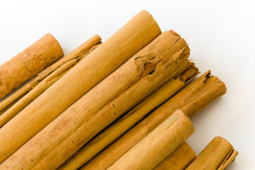 Rolled dry cinnamon isolated on a white background
