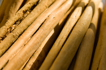 Closeup of several pieces of dry rolled cinnamon