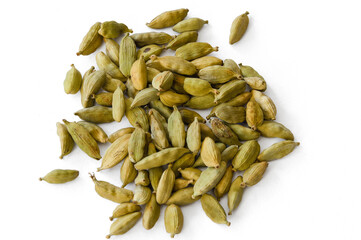 Heap of dry green cardamons on a white background