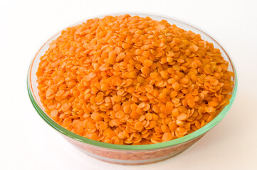 Raw dal in a glass bowl on a white background