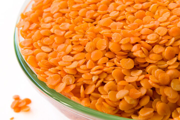 Raw dal in a glass bowl on a white background