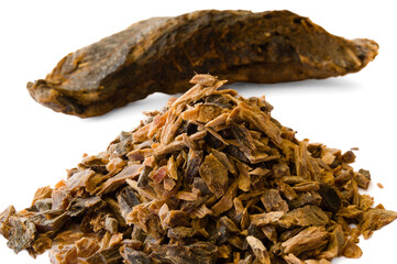 Small heap and chunk of umbalakada aka dry maldive fish on white background
