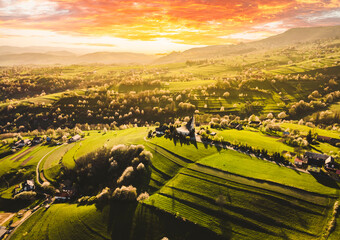 Spring landscape in Slovakia. Polana region, Hrinova. Green spring rural hills landscape, fields, flowering trees, organic farming © Zedspider