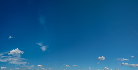 Fototapeta na wymiar Deep blue sky and white different types of clouds in it. Beautiful nature background.