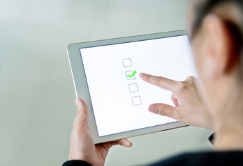 People using digital tablet  voting online