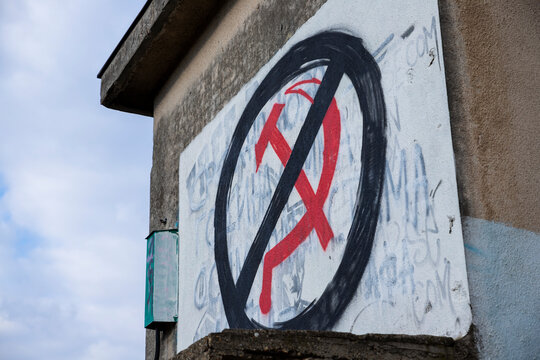 Russian symbol hammer and sickle graffiti crossed out. Sanctions to Russia. Stop the war in Ukraine