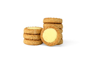 Round shortbread cookies with lemon filling isolated on white background.