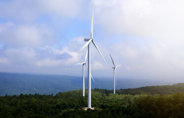 Wind turbine generators are located in the windy mountains, suitable for receiving wind to generate electricity. Clean energy, green energy, renewable.